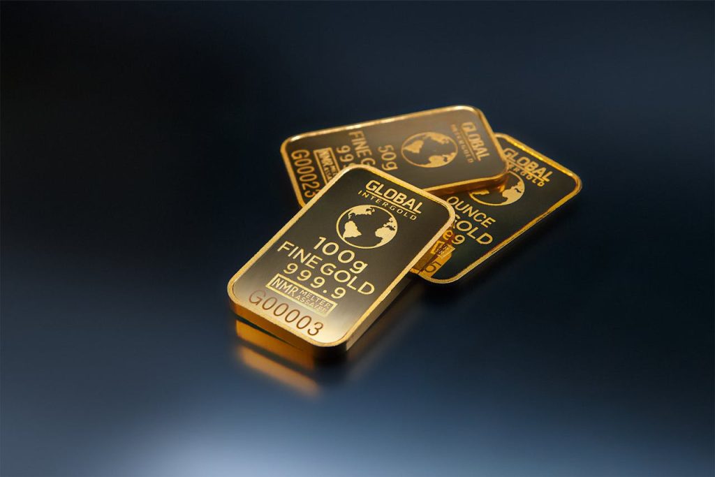 The Art of Drawing Readers In: Your attractive post title goes here Close-up of gold bars on a dark background, representing wealth and investment opportunities.