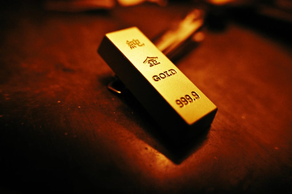 Crafting Captivating Headlines: Your awesome post title goes here A striking close-up of a gold bar showing inscriptions, captured with warm lighting.